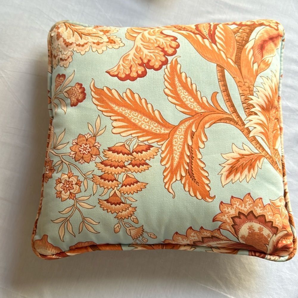 Orange and blue decorator pillow, 14X 14 in